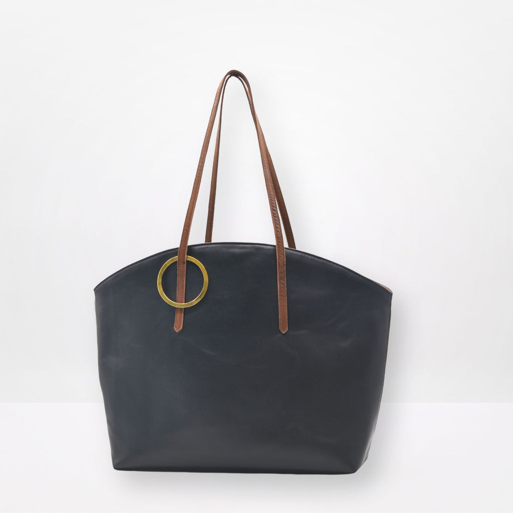 Black tote bag with brown handles on a white background