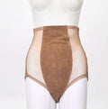 Mannequin wearing a beige bodysuit on a white background